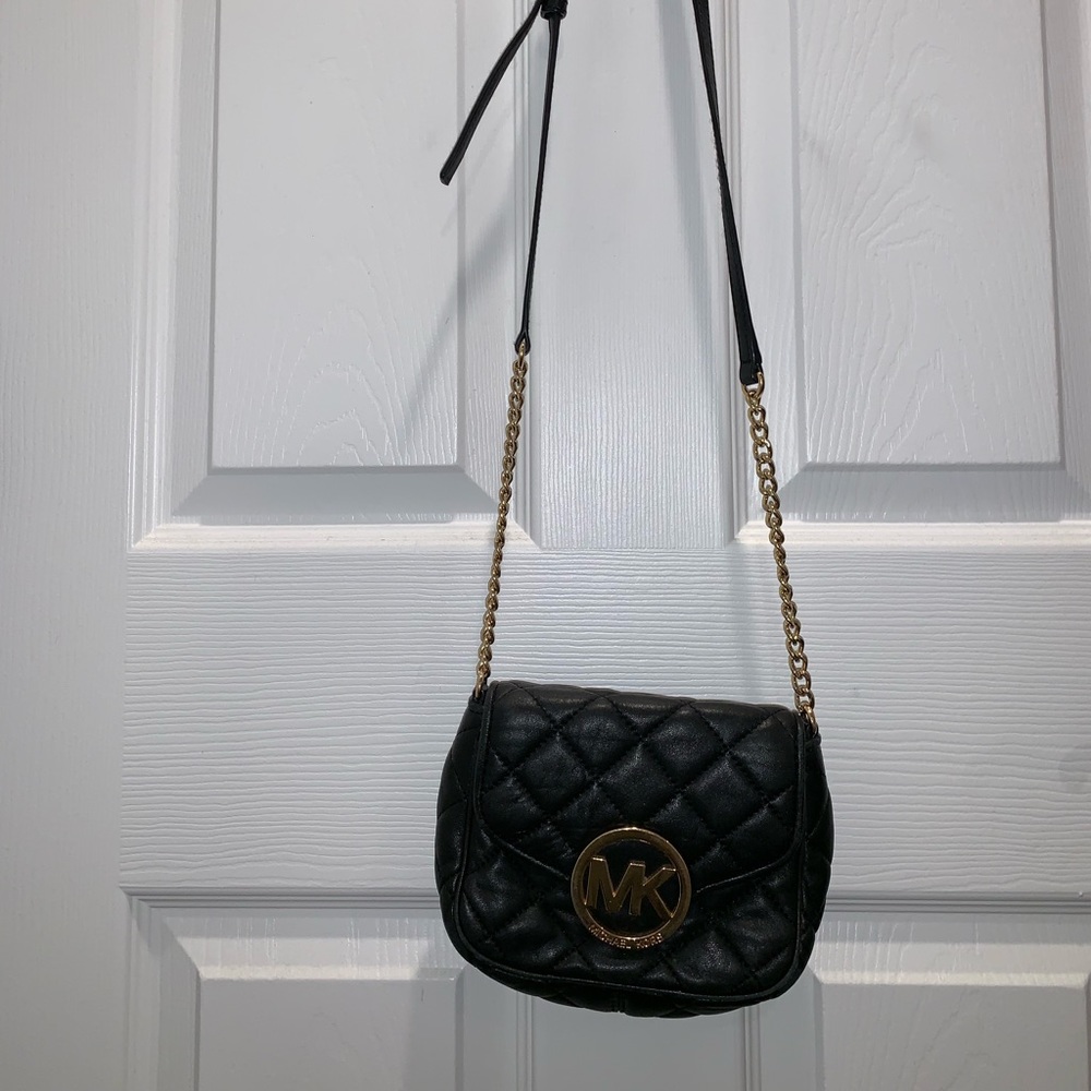 Small black stylish micheal Kors pocket book